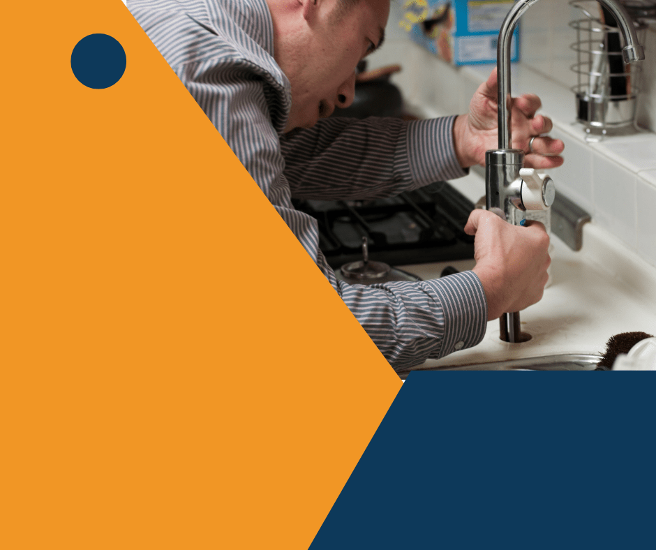 Man repairing a kitchen faucet.