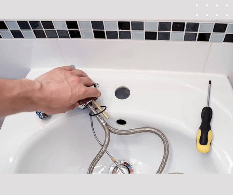 Installing bathroom sink faucet with tools.