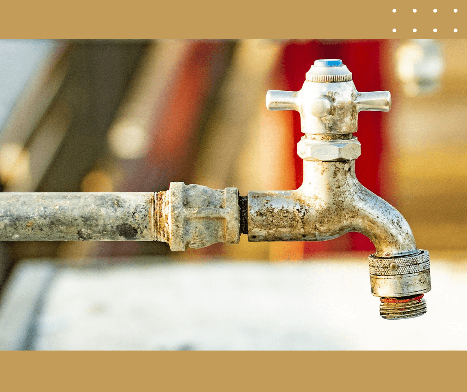 Old rusty outdoor water faucet.