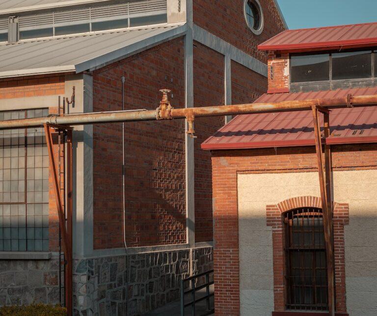 Industrial brick building at sunset.