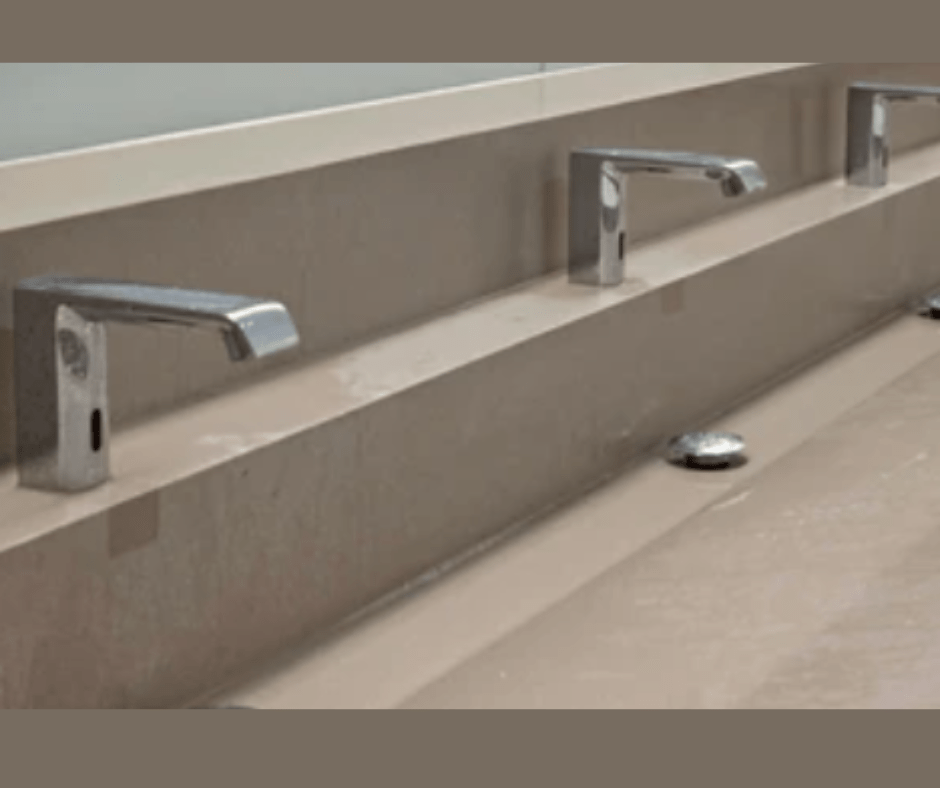 Modern public restroom sinks and faucets.