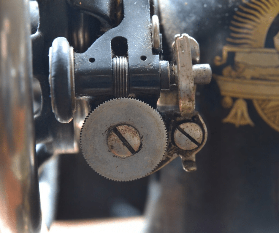 Close-up of vintage sewing machine's tension dials.